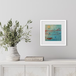May include: A framed abstract painting with a blue, green, and orange color scheme. The painting depicts a landscape with a sun, mountains, and water.