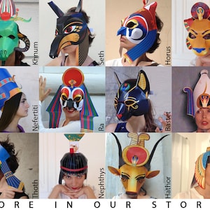 May include: A collage of 12 colorful paper masks and headdresses depicting Egyptian deities. The masks feature various animal and human figures, including a jackal, a cat, a hawk, and a cow. The headdresses are adorned with intricate details and symbols.