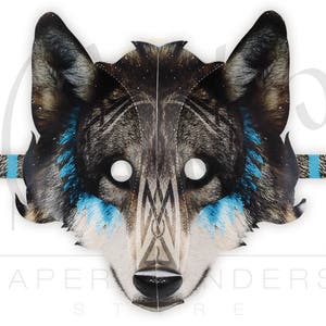 May include: A gray and blue wolf mask with a tribal design. The mask has eye holes and a band for attaching it to the head.