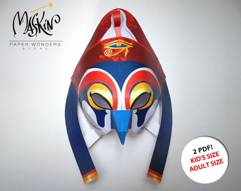 May include: A papercraft mask with a blue, red, and white design. The mask has a stylized eye and a bird-like beak. The text "2 PDF! KID'S SIZE ADULT SIZE" is visible in the lower right corner of the image.