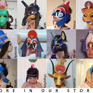 May include: A collage of 12 colorful paper masks and headdresses depicting Egyptian deities. The masks feature various animal and human figures, including a jackal, a cat, a hawk, and a cow. The headdresses are adorned with intricate details and symbols.