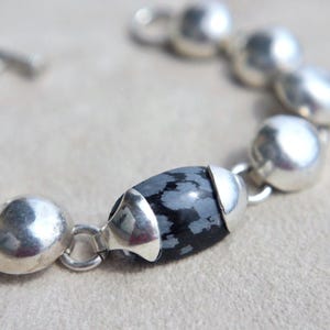 Statement Jewelry Piece Taxco Sterling Bracelet Snowflake Jasper Stone Mexican Silver Design Vintage Collectible Modernist Style Handcrafted Detail Toggle Clasp Feature Half Round Links Pattern Black Stone Accent Elegant Accessory Gift Idea