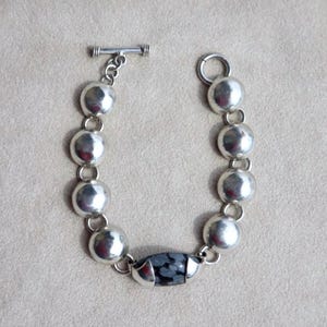 Snowflake Jasper Bracelet Taxco Sterling Silver Mexican Artisan Jewelry Vintage Statement Piece Modernist Design Black Stone Detail Toggle Clasp Feature Handcrafted Quality Collectible Treasure Elegant Accessory Gift Idea Special Occasion