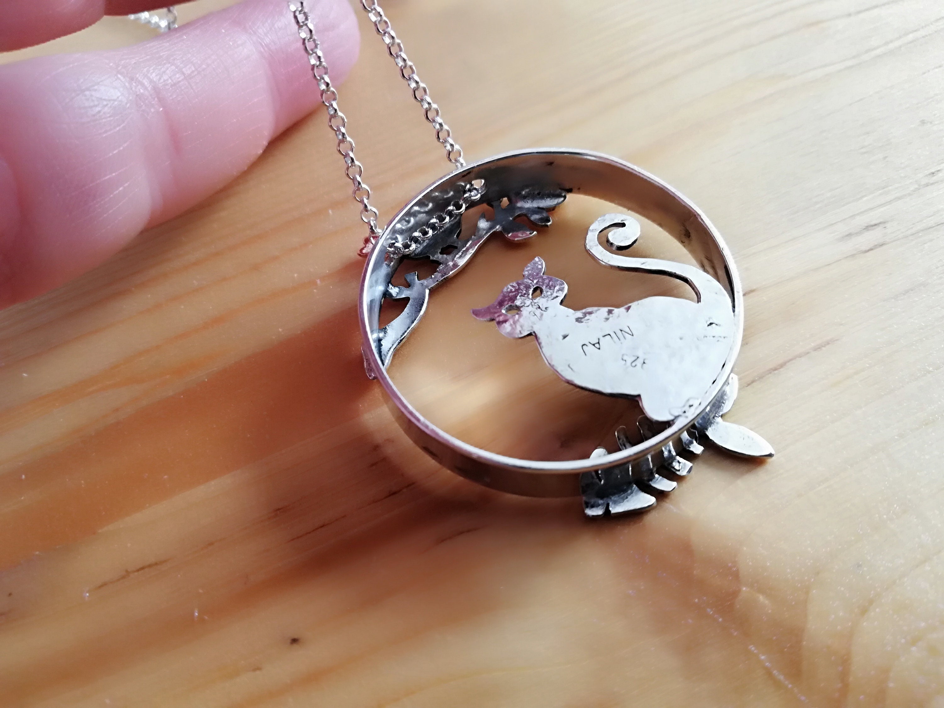 Sterling silver cat and bronze bird pendant with sterling
