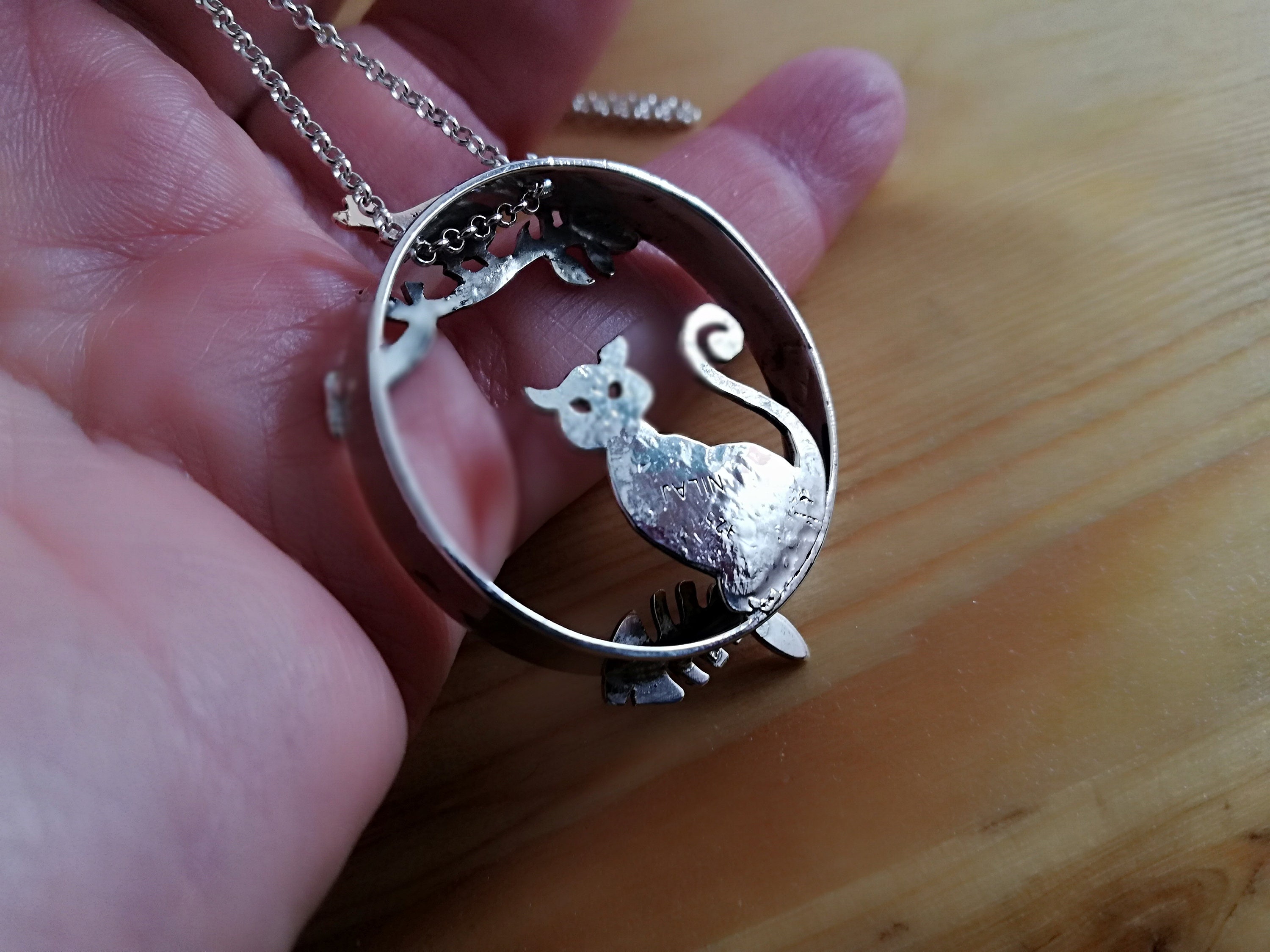 Sterling silver cat and bronze bird pendant with sterling