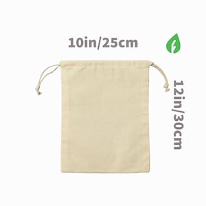 May include: A natural cotton drawstring bag with a 10in/25cm width and 12in/30cm height. The bag is made of natural cotton and has a drawstring closure.