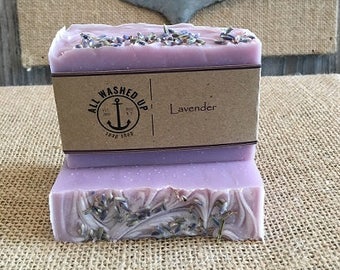 May include: Two bars of lavender soap with a brown label that reads "All Washed Up Soap Shop" and "Lavender".