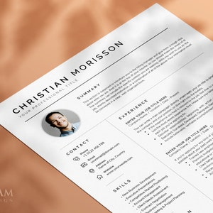 May include: A black and white resume template with a headshot of a man. The resume includes contact information, a summary, skills, and experience sections. The text "ENTER YOUR JOB TITLE HERE" is repeated throughout the document.