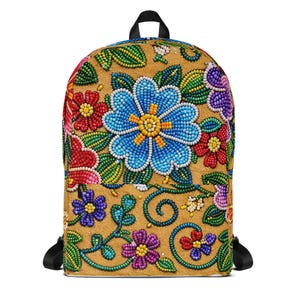 May include: A tan backpack with a colorful floral design. The flowers are made of small, colorful beads in shades of blue, red, purple, and yellow. The backpack has black straps and a black handle.