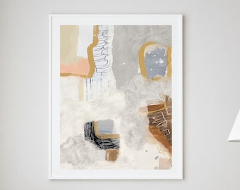 May include: A white couch with two white pillows and a fluffy white throw pillow sits in front of a white wall with a framed abstract painting in shades of gray, brown, and gold. Two wooden stools with a natural finish are in front of the couch.
