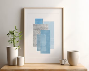 May include: A framed abstract print with a geometric design featuring overlapping rectangles in shades of blue and gray.