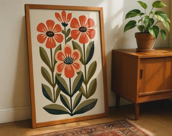 Könnte beinhalten: Ein gerahmter vertikaler Wandkunstdruck mit einer stilisierten Illustration von drei orangefarbenen Blumen mit dunklen Mitten und grünen Blättern auf cremefarbenem Hintergrund. Das Kunstwerk befindet sich in einem hellen Holzrahmen.