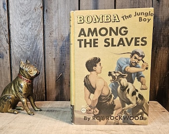 Libro antiguo ~ Bomba, el niño de la jungla entre los esclavos ~ Escrito por Roy Rockwood ~ Copyright 1929
