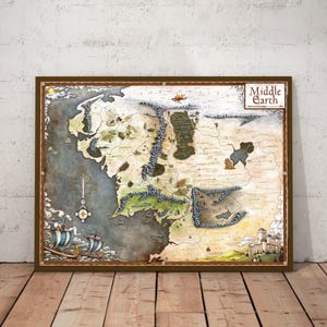 May include: A framed map of Middle Earth, featuring detailed illustrations of landscapes, mountains, and seas. The map has a brown wooden frame and is displayed against a neutral wall. The title "Middle Earth" is visible.