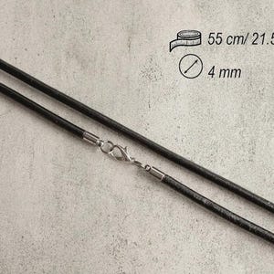 May include: A black cord necklace featuring a silver-toned lobster claw clasp. The cord has a diameter of 4 mm and a total length of 21.5 inches, as indicated by the text and icons printed on the image.