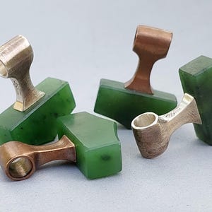 Silver and bronze Viking Mjolnir pendants with natural nephrite jade shown from a different angle.