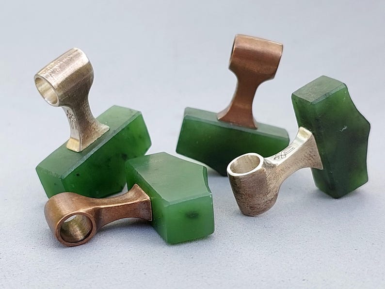 Silver and bronze Viking Mjolnir pendants with natural nephrite jade shown from a different angle.