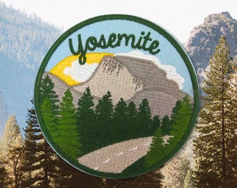 May include: Embroidered patch with a green, blue, and yellow design. The patch features a mountain range, a winding road, and the text "Yosemite".