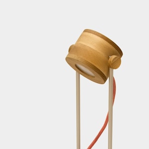 Tejko - wooden table lamp made of beech with walnut inserts. Aluminium legs, high quality switch and plug.