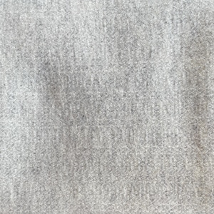May include: Close-up of a light gray fabric with a textured weave. The material has a subtle, heathered appearance, with variations in tone across the surface. The fabric appears soft and possibly suitable for clothing or home decor.