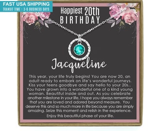 May include: A silver necklace with a turquoise gemstone pendant in a circle setting. The necklace comes in a gift box with a message that reads "Happiest 20th Birthday Jacqueline".