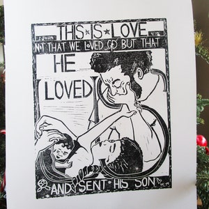 May include: Black and white woodcut print with the text "This is Love" and a quote from the Bible, "Not that we loved God but that He loved us and sent His Son."