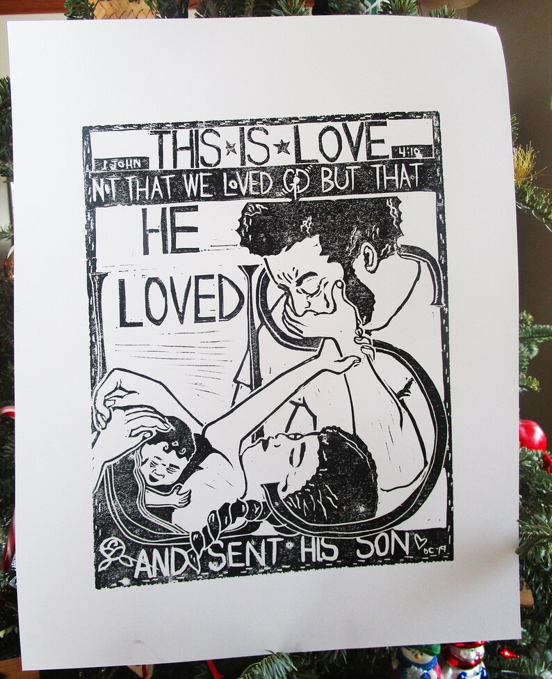 May include: Black and white woodcut print with the text "This is Love" and a quote from the Bible, "Not that we loved God but that He loved us and sent His Son."