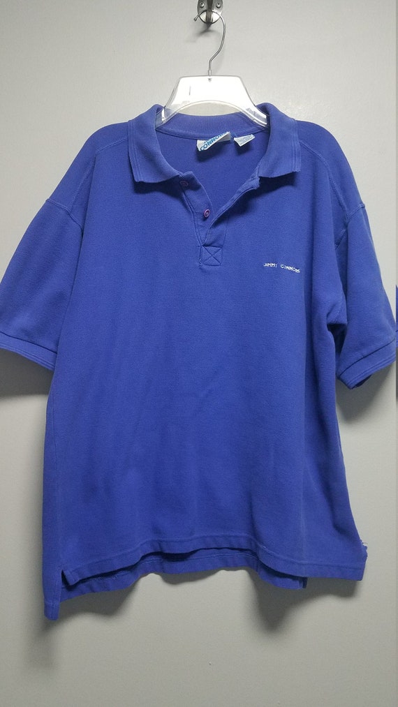 Still With Tags On IT never Worn VINTAGE 1 Polo Style Shirt 1989 by GUESS With Logo on front says GUESSvU.S.A