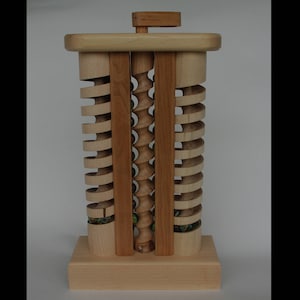 The Mother-in-Law is a wooden toy with marbles made by hand in Vermont.