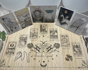 May include: A wooden board with a horseshoe tarot spread layout. The board is engraved with the words "Horseshoe Spread" and has images of moons, stars, and roses. There are 10 tarot cards laid out on the board, including The Star, The Empress, The Lovers, The Wheel of Fortune, and The Sun.