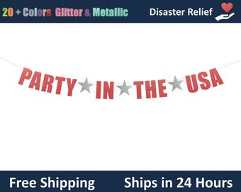 May include: A red glitter banner with the words "PARTY IN THE USA" strung across a white background. Silver star accents separate the words. The banner is for a party or celebration.