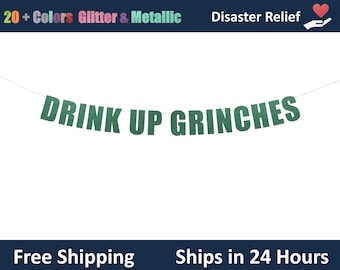 May include: A green glitter banner with the text "DRINK UP GRINCHES" strung across a white background. The banner is festive and includes the text "20+ Colors Glitter & Metallic" and "Disaster Relief".