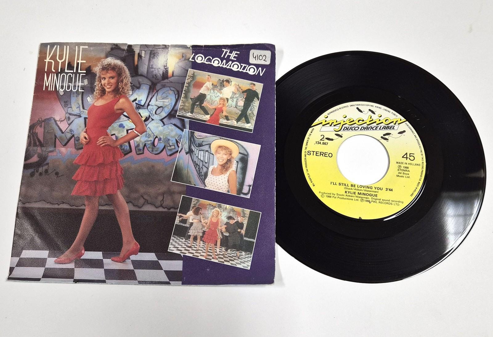 Kylie Minogue – the Loco-motion / I'll Still Be Loving You – 7