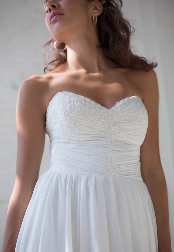 white christmas dresses Designer Taffeta Ruched Strapless Pockets A-Line Wedding Dress main image 1