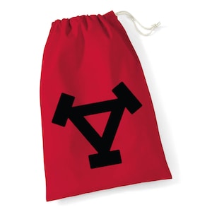 May include: Red drawstring bag with a black triangle and two black circles on the front.