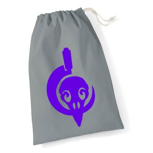 May include: A grey drawstring bag with a purple skull and crescent moon design.
