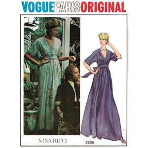 May include: Vogue Paris Original 2886 Nina Ricci sewing pattern envelope featuring a floor-length dress with a V-neckline, short sleeves, and a waist tie. The cover displays a photograph of the dress and a purple illustration of the same design.