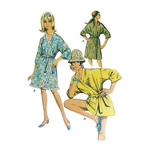 May include: Two women wearing different styles of wrap dresses. The woman on the left is wearing a blue and white floral print dress with a ruffled hem. The woman on the right is wearing a solid yellow dress. Both dresses have long sleeves and are tied at the waist.