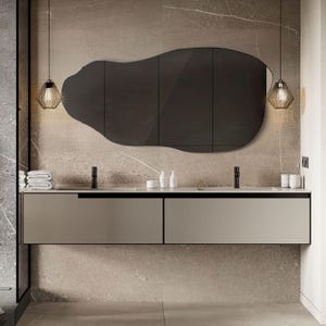 May include: A modern bathroom vanity with two drawers, a white countertop, and two black faucets. A large, irregularly shaped mirror hangs above the vanity, with two black pendant lights on either side.