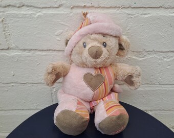 Urso de pelúcia musical Tolo rosa com cordão para puxar - Brinquedo de pelúcia vintage de 2005 para colecionadores.