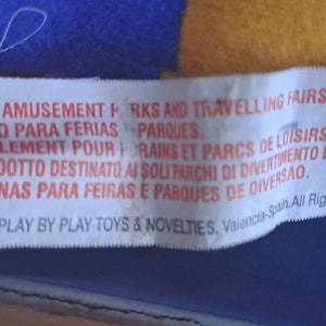 May include: White label with red text stating "FOR AMUSEMENT PARKS AND TRAVELLING FAIRS ONLY."  The label also includes text in Spanish, French, Italian, and Portuguese. The label includes the text "2000 PLAY BY PLAY TOYS & NOVELTIES, Valencia-Spain. All Rights Reserved."