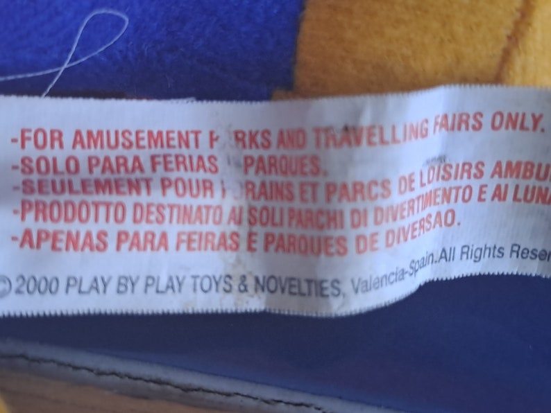 May include: White label with red text stating "FOR AMUSEMENT PARKS AND TRAVELLING FAIRS ONLY."  The label also includes text in Spanish, French, Italian, and Portuguese. The label includes the text "2000 PLAY BY PLAY TOYS & NOVELTIES, Valencia-Spain. All Rights Reserved."