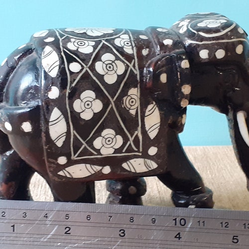 Carved Wooden Inlaid Indian Elephant Sculpture from order Asia. Vintage Heavy Rosewood with ornate bone (not elephant) inlaid floral decoration.