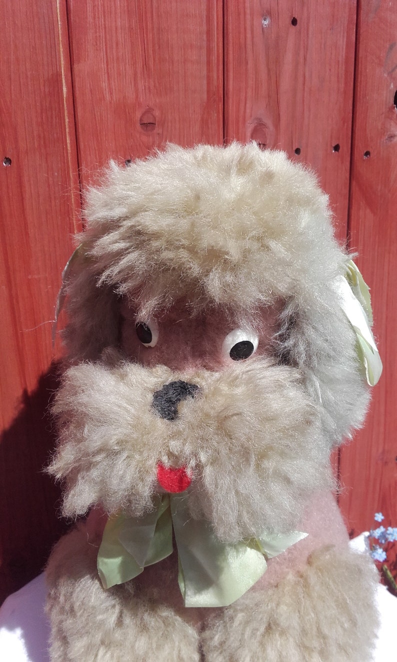 pink dog toy that sticks tongue out