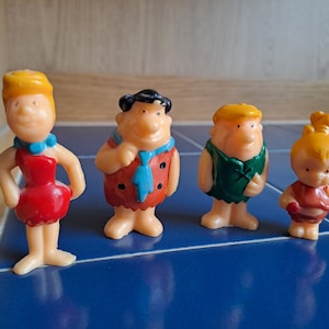 Vintage Fred, Wilma, Pebbles Flintstone and Barney Rubble Dollhouse miniature Doll Toy Topper Figures.