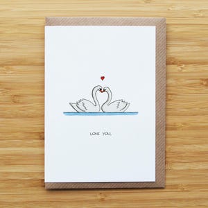 Tarjeta de cisnes enamorados