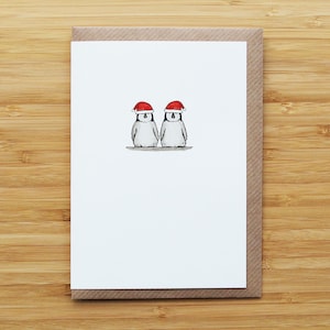 Biglietto di Natale con cuccioli di pinguino