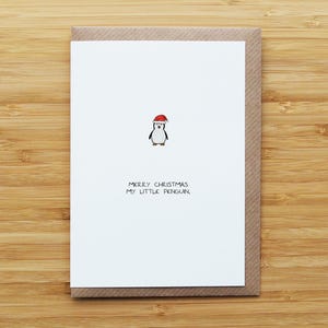 Tarjeta navideña del pequeño pingüino
