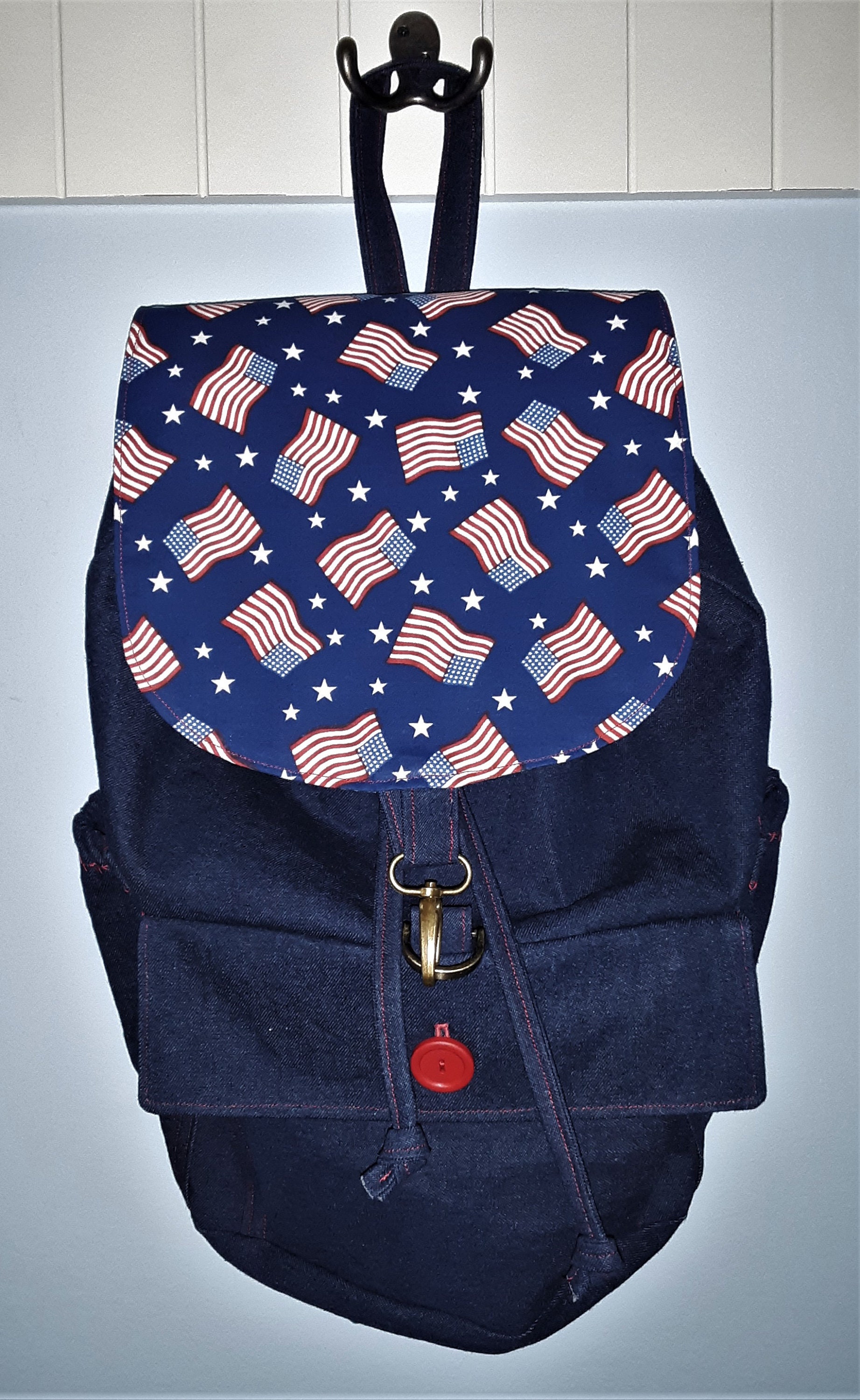 Mini Denim Backpack Purse. Frayed Flower Pattern. Cinch closure. Flap.  Zipper