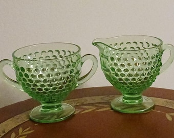 Vintage Fenton green hobnail uranium glass creamer and sugar bowl set. Glows under UV light.